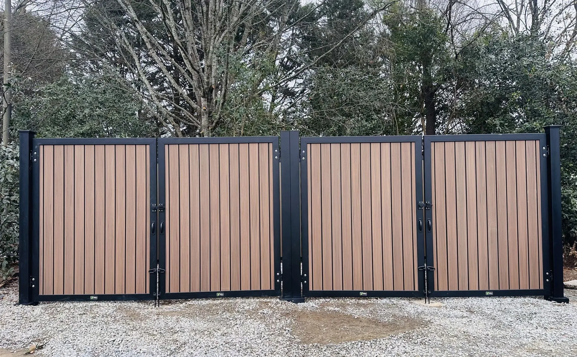 Wooden fence gate with metal frame.