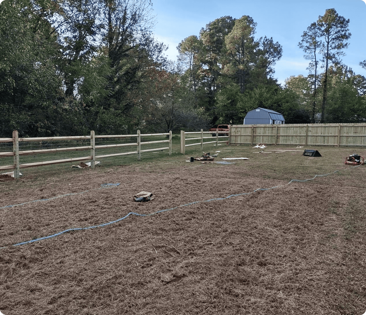 Backyard with wooden fences and shed.