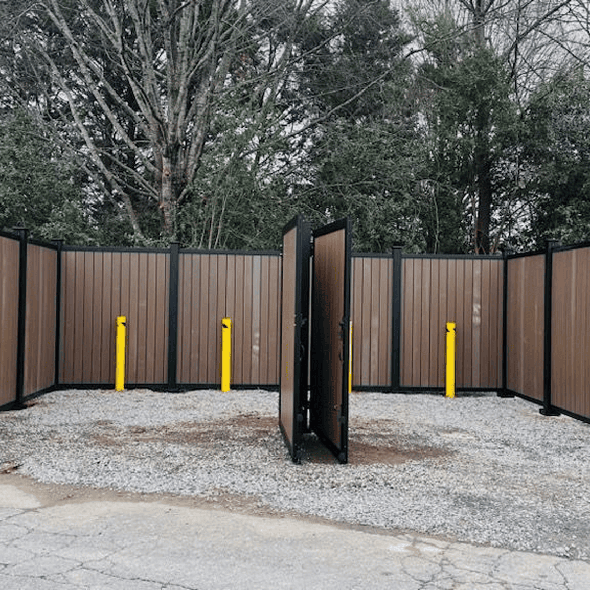 Enclosed area with wooden fence and gate.