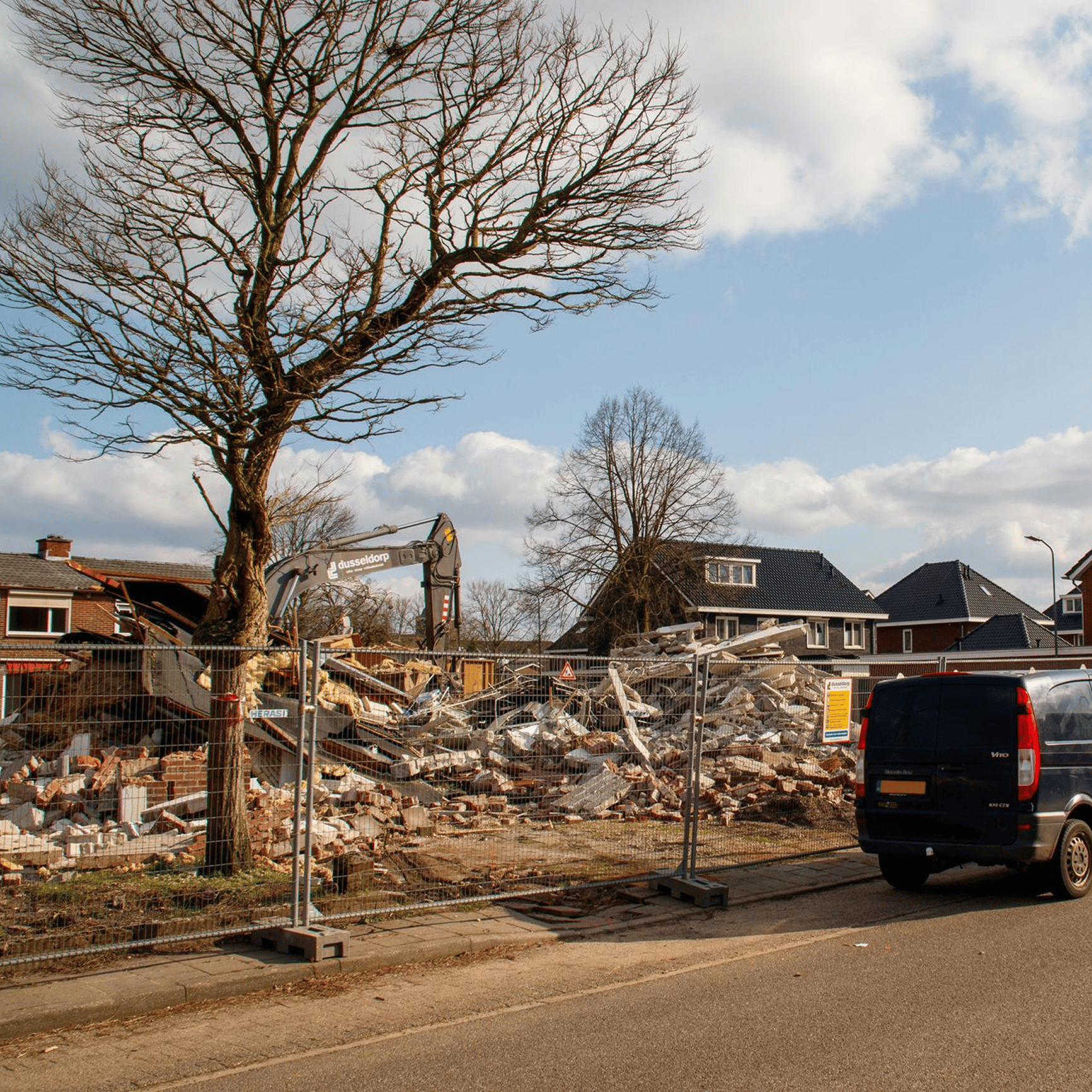 Demolished building site with construction debris.