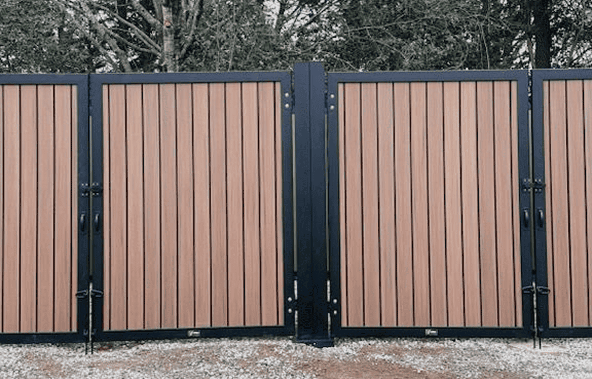 Double wooden driveway gate with metal frames